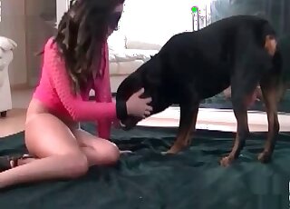 Tanned slag in pink fucks a hot pooch